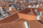 aerial-shot-rooftops-city-buildings-with-red-shingles.jpg