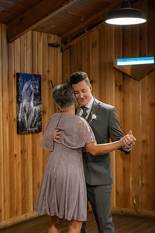 Mother of the bride dancing with groom 