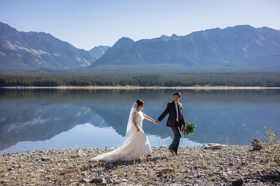 Bride and Groom hold hands while walking