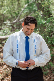 Groom admiring his new wedding band