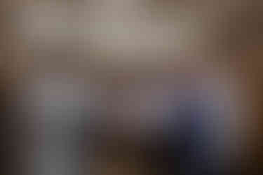 groomsmen cheersing their old fashions in mens locker room