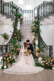 grand staircase with couple sitting