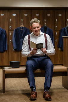 Groom reading brides pre wedding letter to him