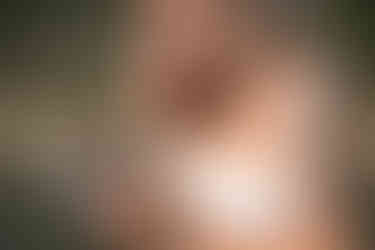 Bride wiping away tears while reading her vows at Rundleview Parkette, surrounded by mountain scenery.