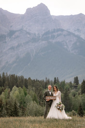 Couple with Just Married sign in the mountains