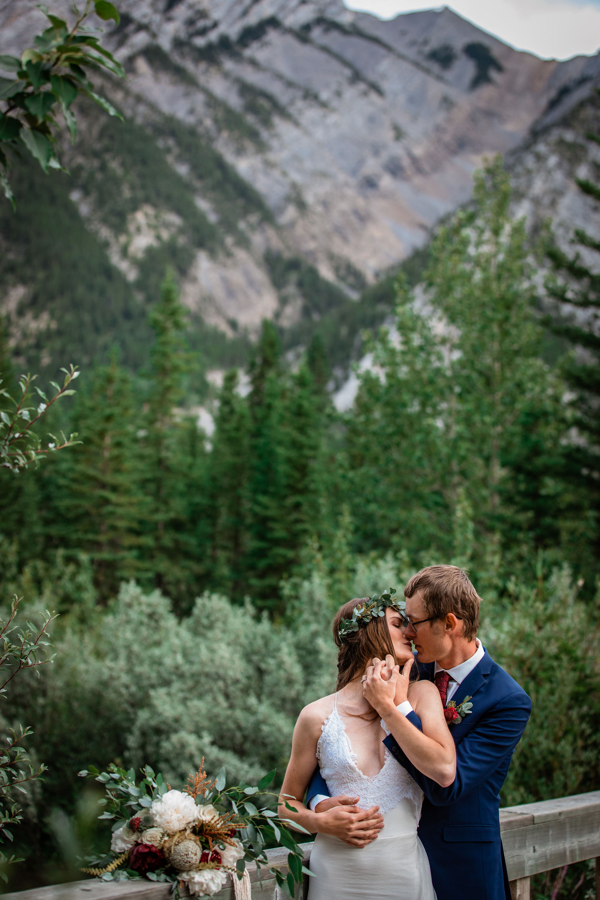 Bride and groom kissing.