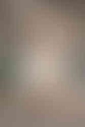 the bride and groom embrace at the Moraine Lake wedding venue, surrounded by mountains and rocks