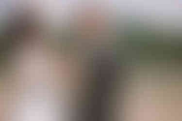 bride and groom holding kittens on their wedding day