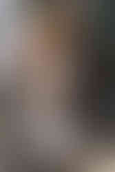 Bride adjusting her boots while stepping out of a pickup truck on their Crowsnest Pass wedding day