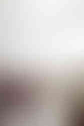 Bride and groom walking hand in hand beside their bridal party