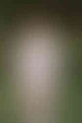 Groom wearing a light suit standing outdoors at a Kananaskis wedding