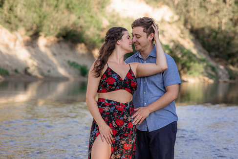engagement photos, calgary engagement, engagement ring, couple by river, couple embrace, river engagement