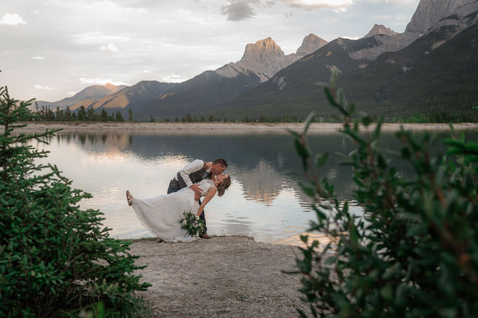 Bride and Groom lake kiss