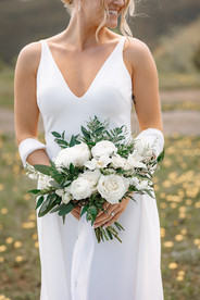 Bride holding her bouquet during portraits at an Airbnb wedding venue