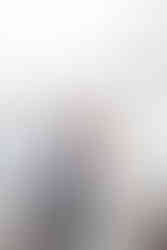 Bride and groom smiling at one another