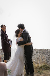Bride and groom hug at ceremony