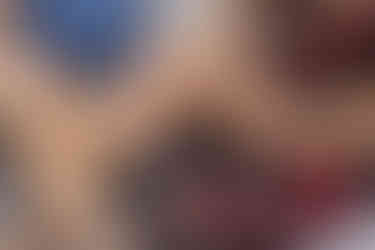 Champagne flutes filled with champagne and a close up of the engagement ring