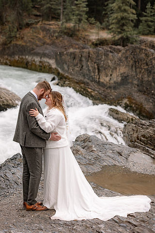 couple in front is waterfall