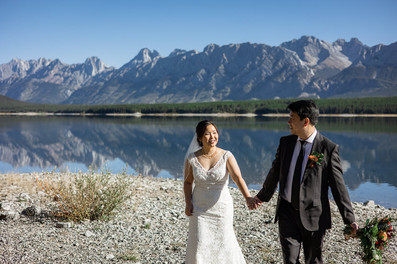Bride and Groom hold hands in Kananaskis