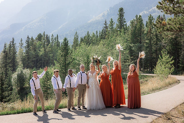 Bride and groom celebrate with their wedding party 