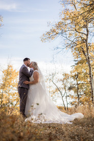 bride and groom kiss at fall intimate elopement