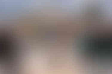 groom dip kissing bride with bubbles