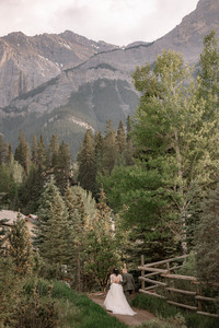 couple walking in Canmore surrounded by mountains