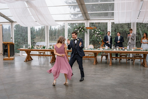Groom and mother in law dancing together