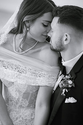 man leaning on woman's shoulder
