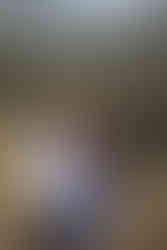 couple snuggling in the woods