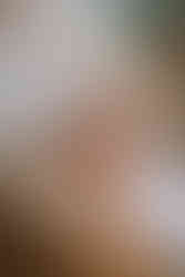 Close-up of the bride adjusting her shoes while getting ready moments before a Bragg Creek wedding