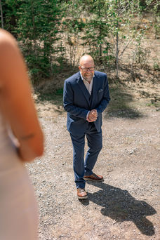 Father reacting during a first look at a Bragg Creek Airbnb wedding venue