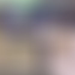 Residents walk around a job fair with tables and posters displaying the redevelopment plans.