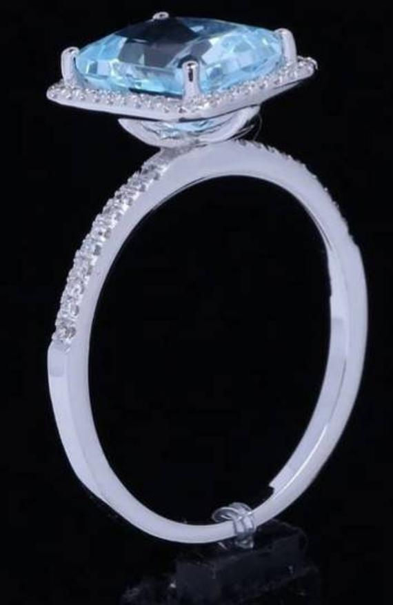 Thumbnail: Studiodragonfly19 Memorial Ash Solitare 10kt Emerald Cut Sky Blue Diamond Ring