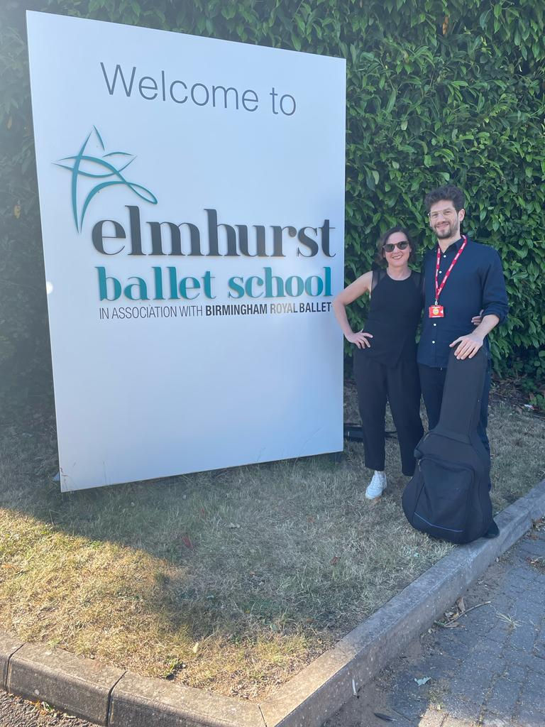 Ana Garcia and Adrian Sola posing at Elmhurst ballet school entrance