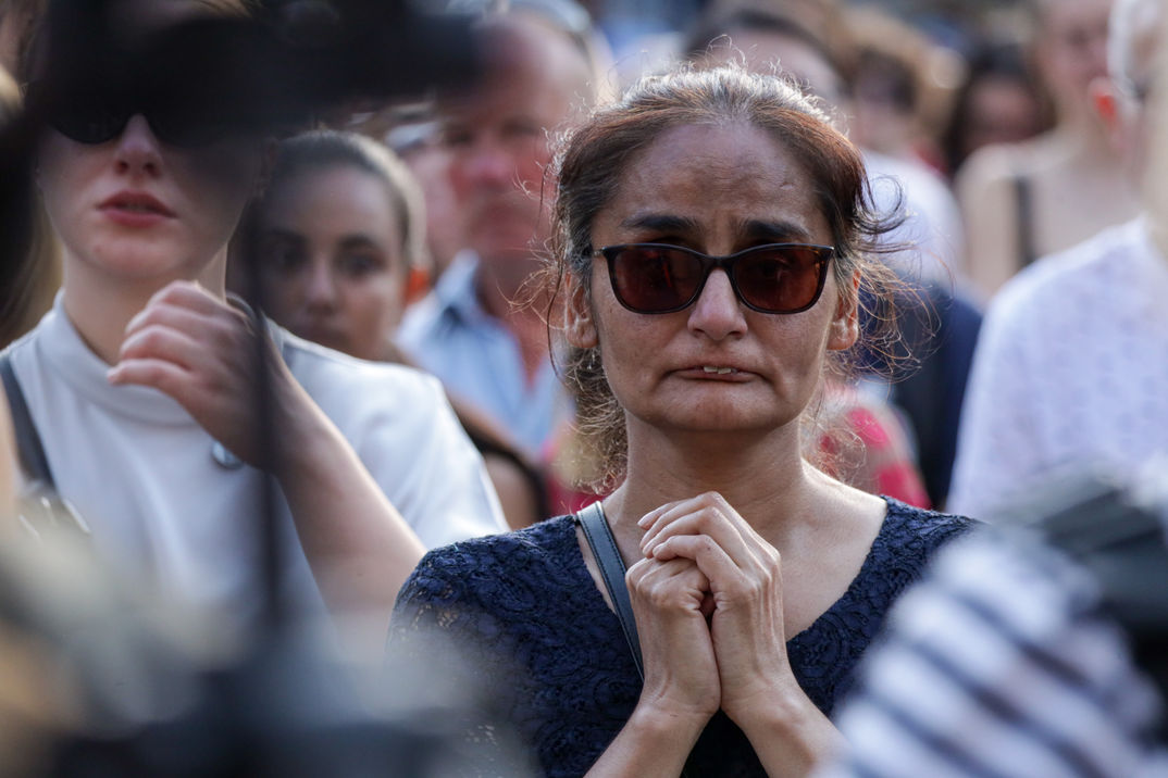 Moment of Silence

At 6pm, mourners observed a minute of silence as some prayed.
