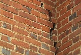 brick wall with crack down it