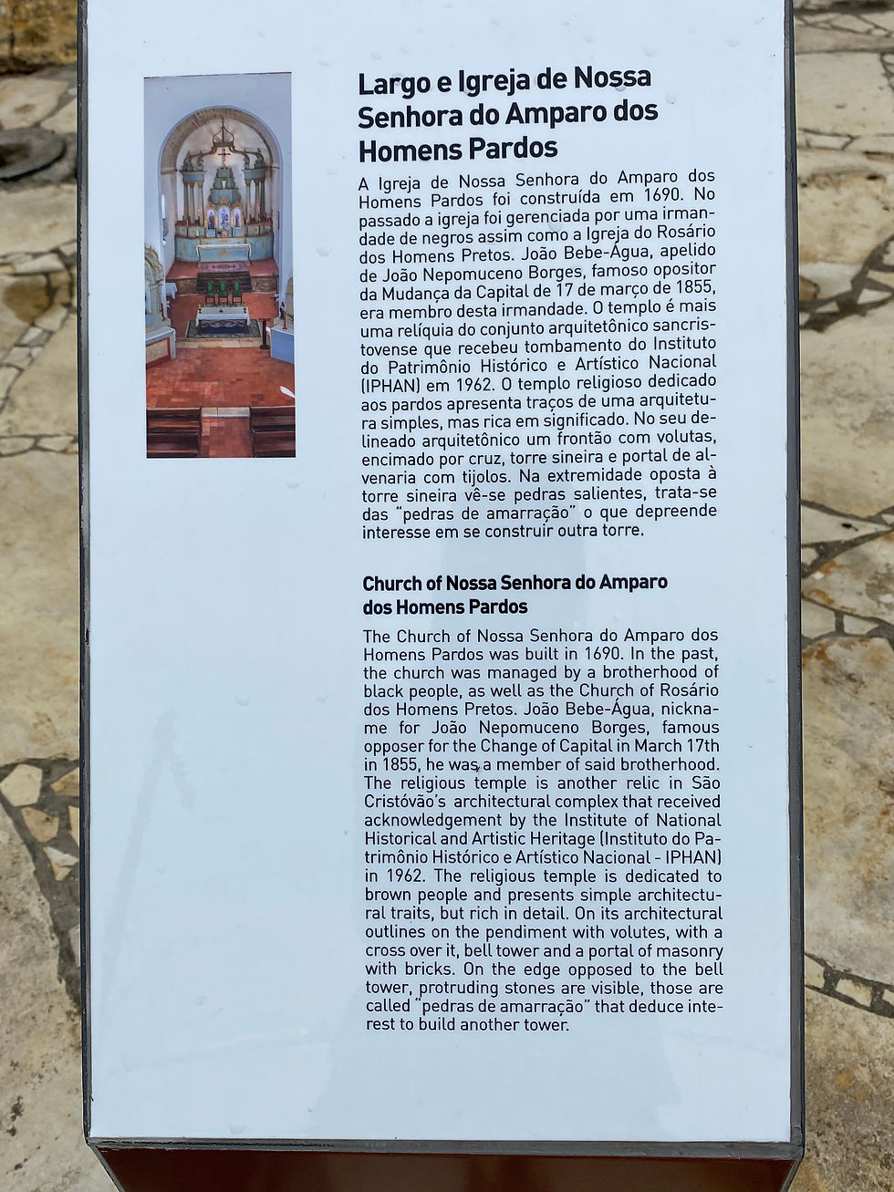 A bi-lingual (Portuguese-English) sign in the town of São Cristóvão (Saint Chrispopher), Sergipe State Brazil. This sign is for the Church of Nossa Senhora do Amparo dos Homens Pardos.
