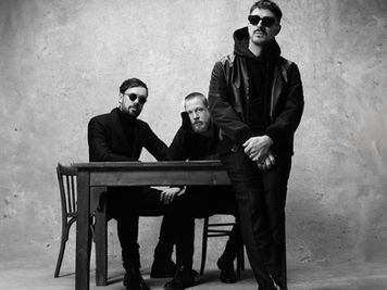 A shift from traditional folk rock to acoustic masterpiece: Woman by Mumford and Sons