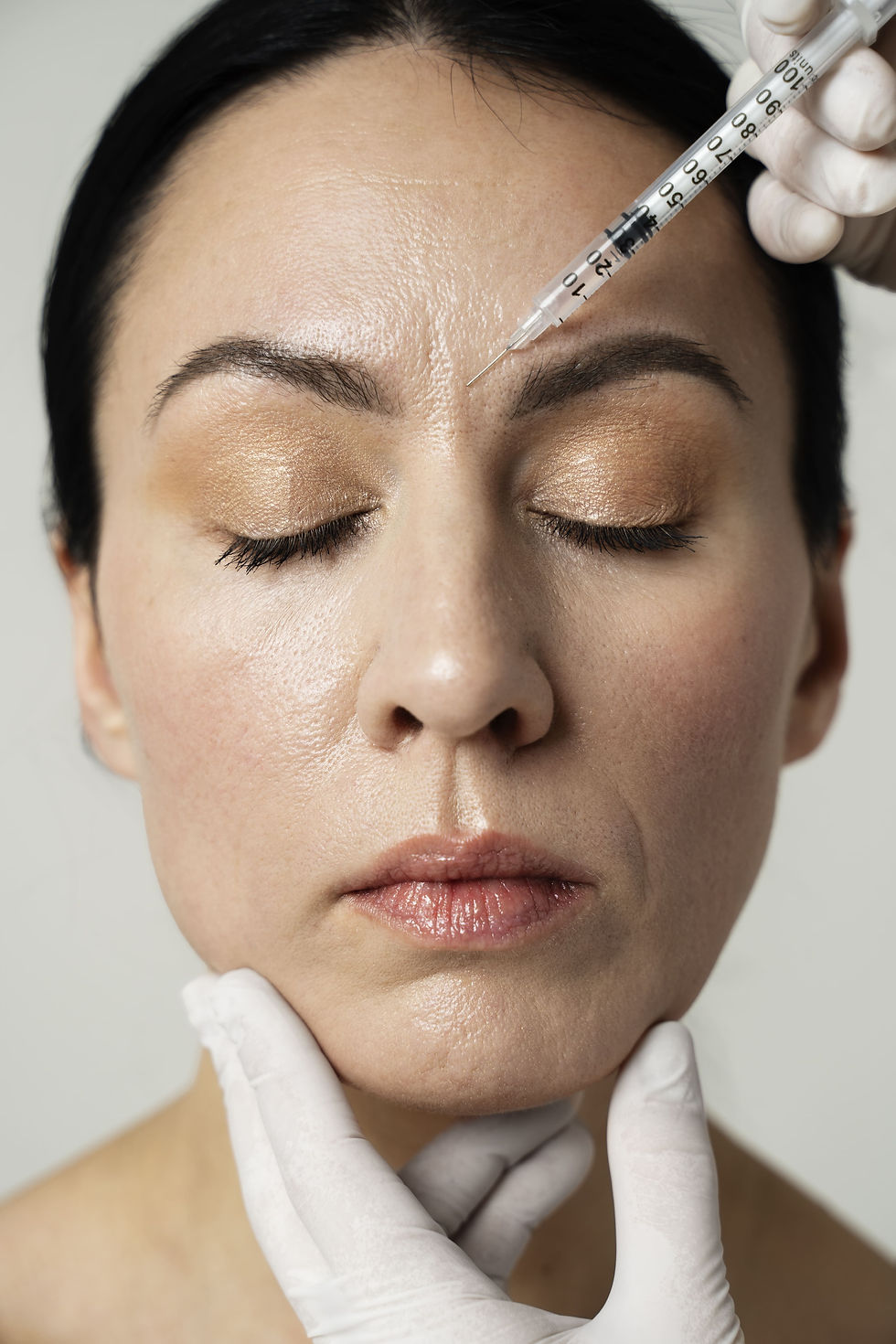 front-view-hand-injecting-woman-s-face (1).jpg