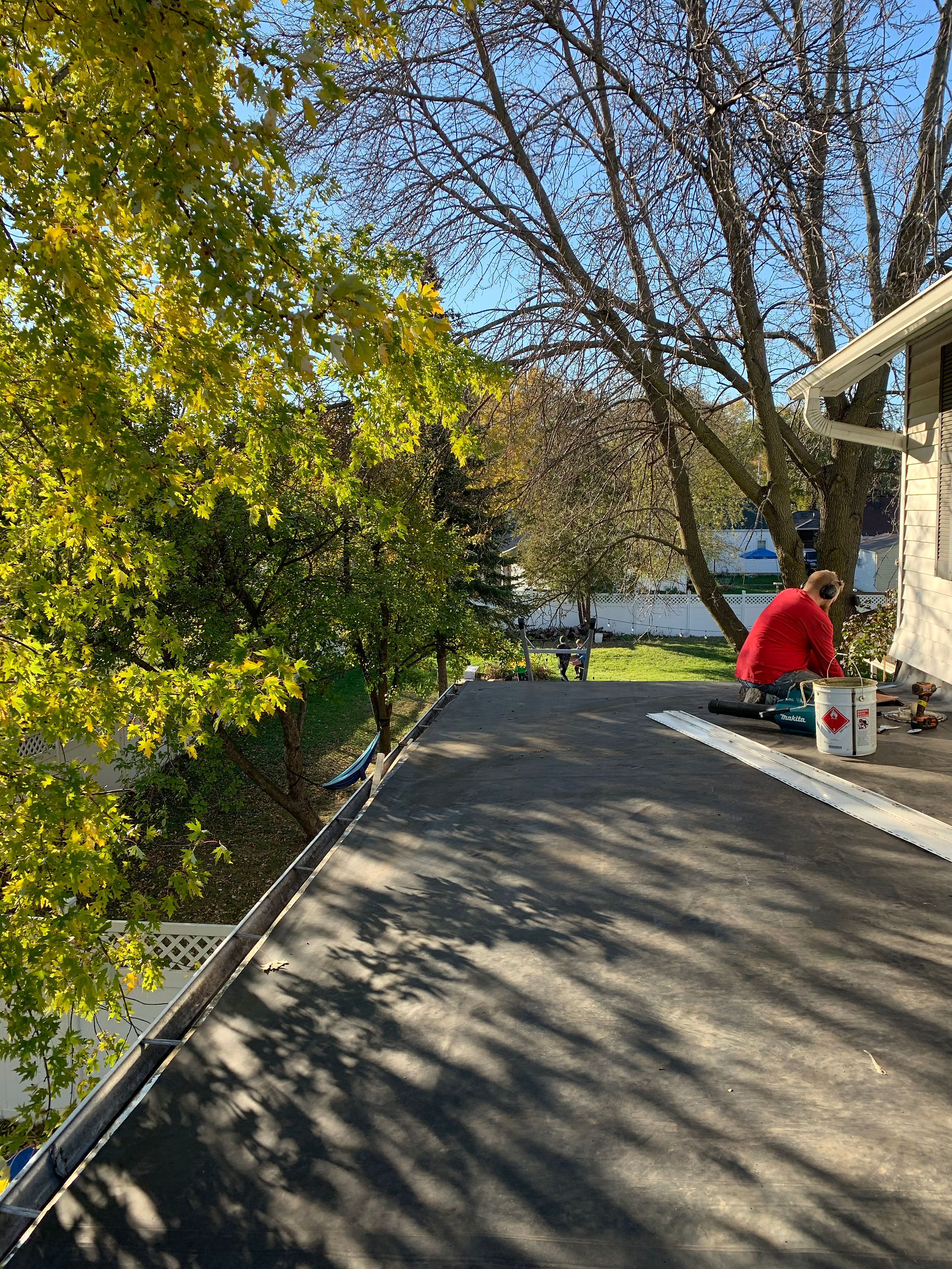 Crown Roofing Services President fixing flat roof of his own home.