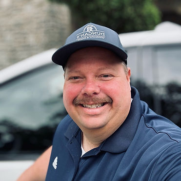 Selfie of Jeremy the Window guy standing next to his Duncan's Mini Van