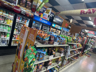 Variety of Herr’s chips and snack options available at Palace One Stop Shop convenience store.”