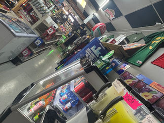 Variety of drink and snack options available at Palace One Stop Shop convenience store.”