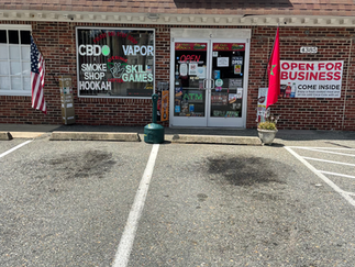 “Exterior of Palace One Stop Shop tobacco and convenience store”