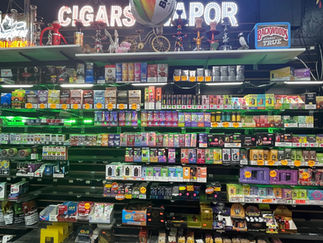 Wide selection of cigar wraps, cigarillos, and smoking accessories displayed at Palace One Stop Shop smoke shop.”