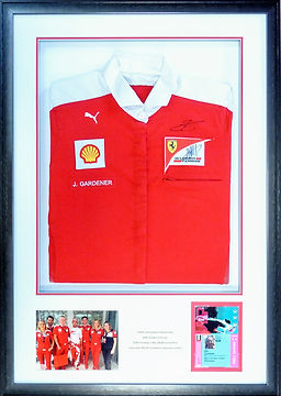 Framed Ferrari Formula 1 team shirt, pit pass and photograph.
