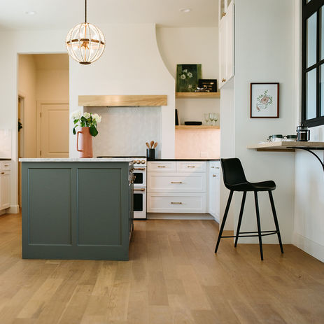 Our Modern French Country kitchen features an open layout with an interior window.