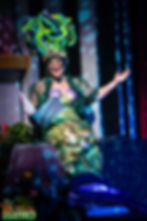 Pantomime mermaid with a shell bra, and elaborate seaweed head dress