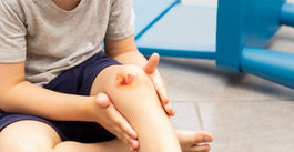 Child with injured knee